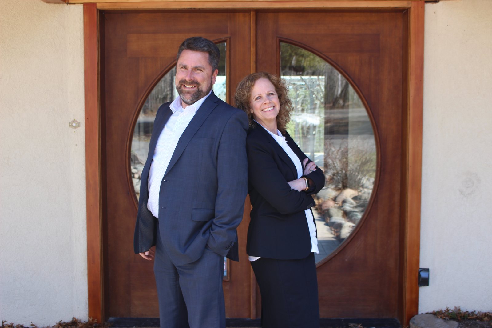 Cindy Hedlund and Jonathan Thornton of The Northland Team outside a Duluth home